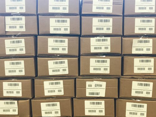 stacked boxes for shipping with SKU tracking